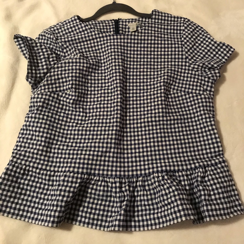 Checkered blue and white blouse.